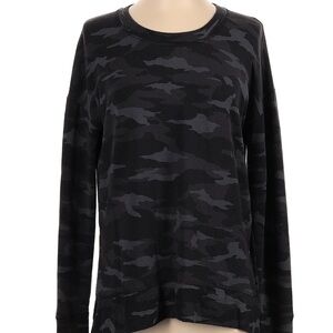 Athleta size extra small sweatshirt and a black camo pattern